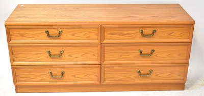 Lot 1 - G-PLAN; an elm side-by-side chest of six...