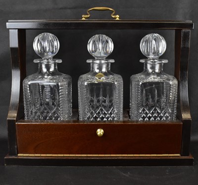 Lot 173 - A 20th century mahogany cased three-decanter...