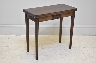 Lot 257 - WARING & GILLOW; a Regency style mahogany fold-...