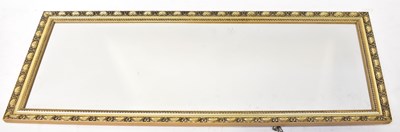 Lot 74 - A rectangular gilt-framed wall mirror with...