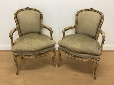 Lot 741 - A pair of French painted open armchairs with...