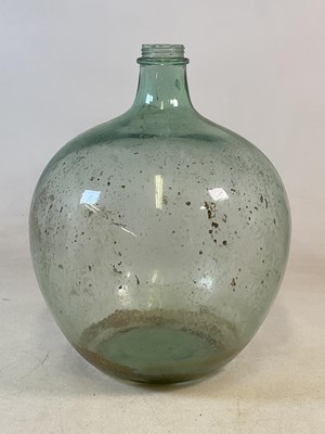 Lot 464 - A large green glass carboy, height 60cm.