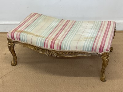 Lot 773 - A large French footstool with carved and...