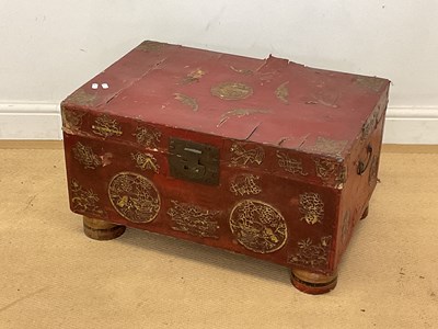 Lot 479 - A Chinese red lacquered leather wooden trunk...