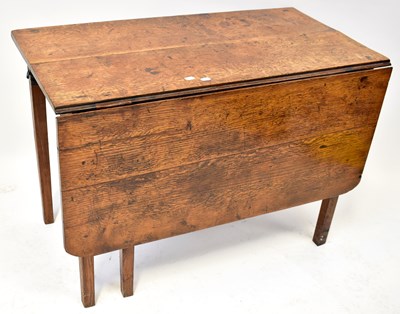 Lot 36 - A 19th century oak drop-leaf supper table on...