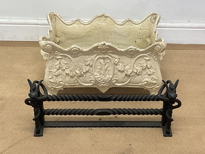 Lot 733 - A cast iron garden planter decorated with...