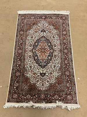 Lot 726 - A Persian rug with floral borders, 155 x 93cm.