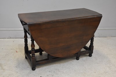 Lot 112 - TITCHMARSH & GOODWIN; a oak drop leaf dining...