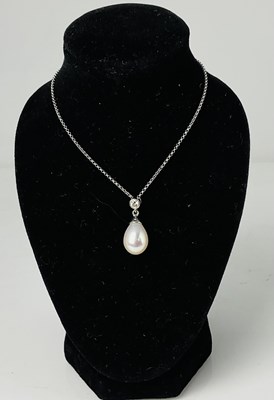 Lot 586 - An 18ct white gold cultured pearl and diamond...