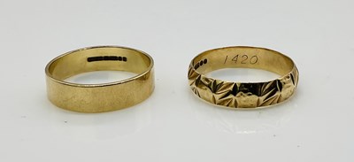 Lot 624 - Two 9ct yellow gold band rings, sizes R and R...