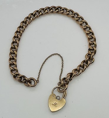 Lot 619 - A 9ct gold curb link bracelet, with padlock...