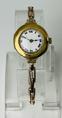 Lot 690 - An 18ct yellow gold lady's vintage wristwatch,...