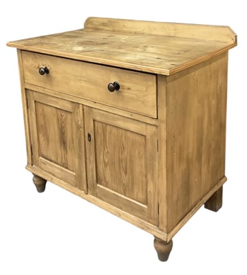 Lot 73 - An early 20th century pine single drawer wash...
