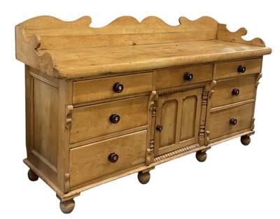 Lot 11 - A Victorian pine kitchen dresser base, with...