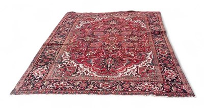 Lot 98 - A large modern Persian Heriz style red ground...