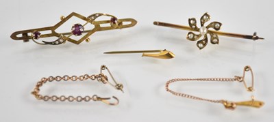 Lot 1441 - A 9ct yellow gold ruby and seed pearl set bar...