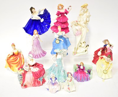 Lot 116 - ROYAL DOULTON; thirteen figures, comprising...