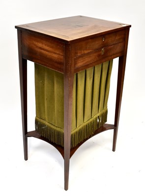 Lot 26 - An Edwardian mahogany sewing table with brass...