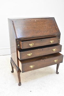 Lot 95 - A 19th century oak bureau, height 99cm, width...