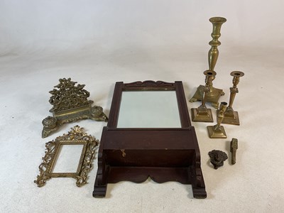 Lot 201 - An oak mirror with a box and quantity of brass,...