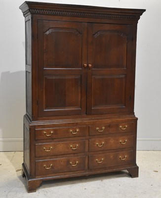 Lot 179 - An 18th century dark oak press cupboard with...