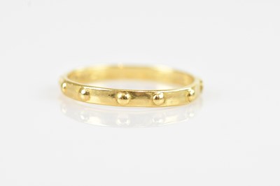 Lot 2479 - A yellow metal wedding band set with studs,...