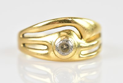 Lot 2418 - A yellow metal dress ring set with a round...