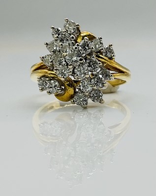 Lot 585 - An 18ct yellow gold diamond set ring, the...