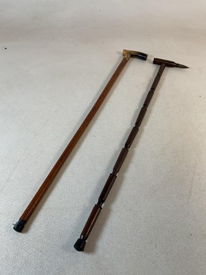 Lot 271 - A trench art walking cane, made of nine shell...