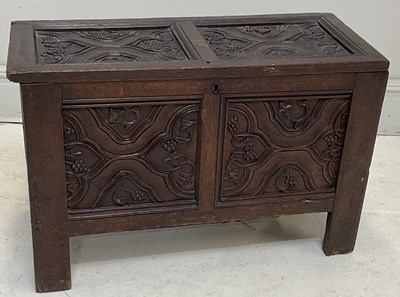 Lot 62 - A 17th century English carved oak coffer, the...