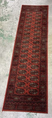 Lot 722 - A machine woven hall runner, in Middle East...