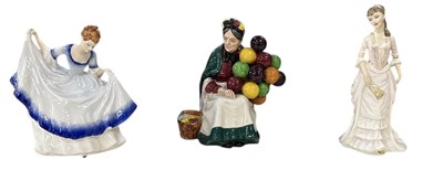 Lot 554 - ROYAL DOULTON; two boxed porcelain figures of...
