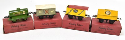 Lot 258 - HORNBY; four O gauge wagons and vans