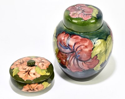 Lot 56 - MOORCROFT; a ginger jar and cover decorated in...