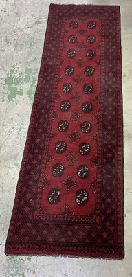 Lot 714 - A hand woven Middle Eastern runner, made in...