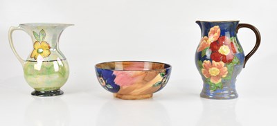 Lot 1920 - ROYAL DOULTON; a hand painted jug with floral...