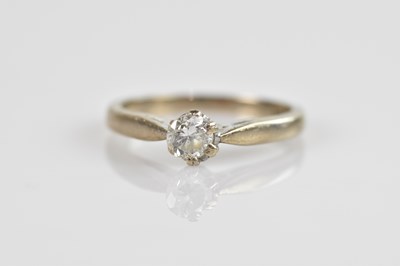Lot 2382 - An 18ct white gold diamond solitaire dress...