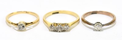 Lot 1084 - Three 18ct yellow gold and small diamond set...