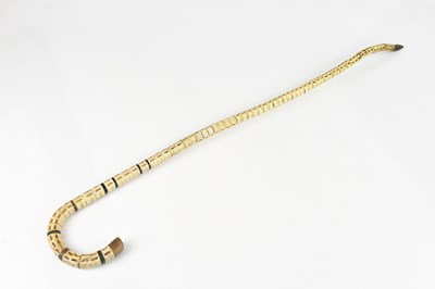 Lot 1030 - A vertebrae walking stick, 85cm.