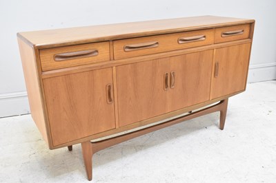 Lot 7 - G PLAN; a 1960s teak sideboard with three...