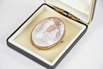 Lot 1305 - A 9ct yellow gold cameo brooch, carved with...