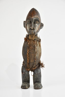 Lot 1194 - An African carved Teke figure, bound with...