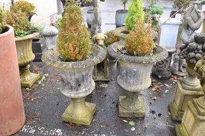 Lot 332 - A pair of reconstituted stone garden urns on...