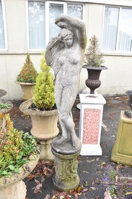 Lot 334 - A large reconstituted stone figure of a maiden,...