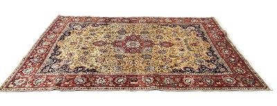 Lot 389 - A wool and silk yellow ground Caucasian carpet,...