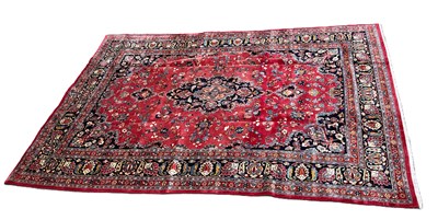 Lot 391 - A red ground Caucasian hand knotted woollen...