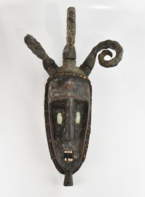 Lot 1195 - A large West African ceremonial mask/headdress,...