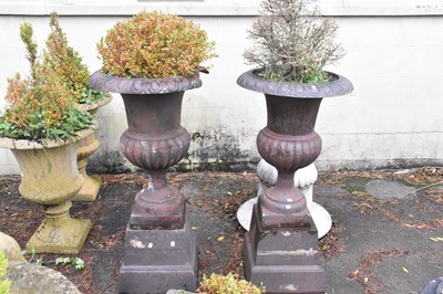 Lot 325 - A pair of cast iron garden planters on...