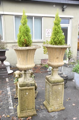 Lot 335 - A pair of reproduction reconstituted stone...