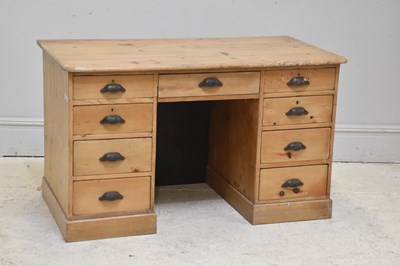 Lot 79 - A Victorian pine kneehole desk with an...